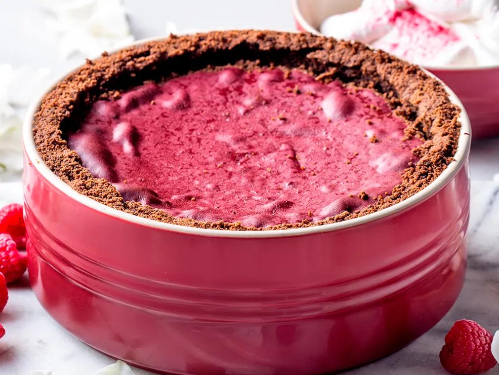 Red Velvet Cheesecake with Meringue Frosting & Raspberry Dust